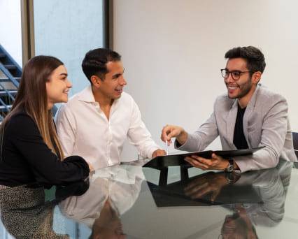Immigration Consultant Guiding Couple For Visa Process