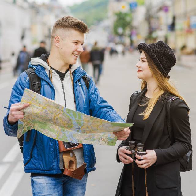 A Couple Travelling on Street- Tourist Visa- Skybird International